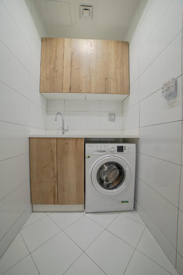 Platinum Coast Hotel Apartments Фуджейра Екстериор снимка A washing machine in a laundry room
